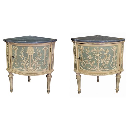 A pair of Neoclassical italian white and pale green painted and carved walnut and poplar corner cupboards, executed after a design by Leonardo Marini(Turin 1737-1810).